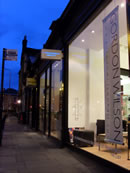 Gordon Wilson Hairdressing shop front at night